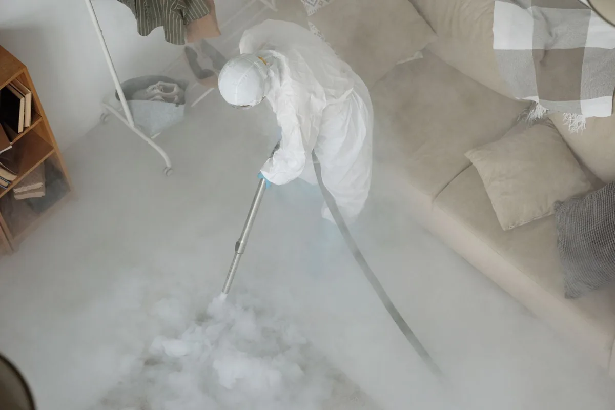 Biohazard cleanup technician in protective equipment, Urbandale, IA